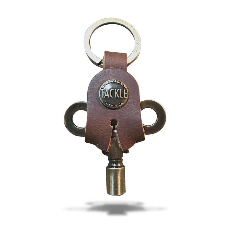Timekeepers Drum Key from Tackle shown in antique brass on a white background
