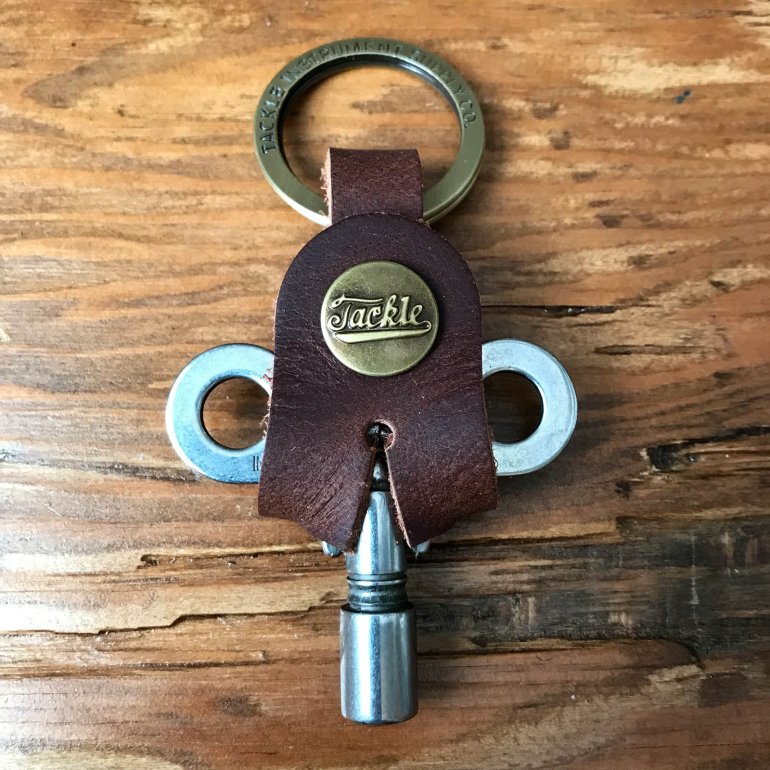 Timekeepers Drum Key from Tackle shown in raw steel at an old wooden surface