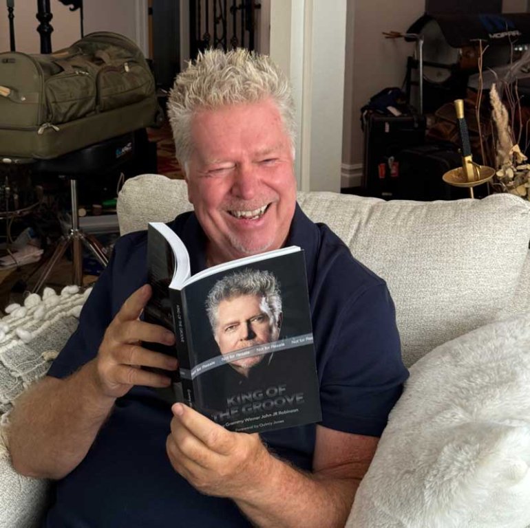 John reading his book